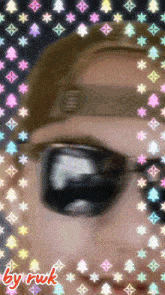 a picture of a man wearing sunglasses and a hat with the words by ruk on the bottom