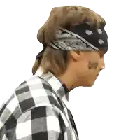 a man with a bandana on his head has a tattoo on his face