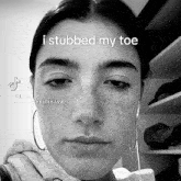 a black and white photo of a woman with a caption that says i stubbed my toe