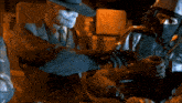 a blurred image of a dark room with a few lights on