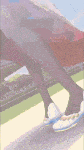 a person 's legs are shown in a cartoon with a stadium in the background