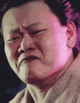 a close up of a man 's face making a funny face