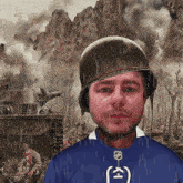 a man wearing a helmet and a blue shirt has the letter k on his shirt