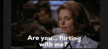 a woman is sitting in front of a group of soldiers and says are you flirting with me .