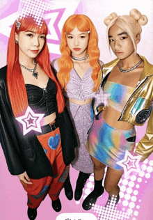 three girls are posing for a picture and one has a star on her chest