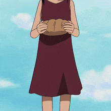 a girl in a red dress is holding a piece of paper in her hands
