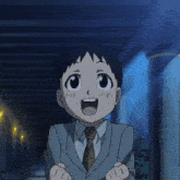 a young boy in a suit and tie is giving the middle finger