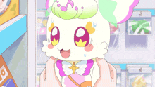 a cartoon character is being held in someone 's hands and has a star on its chest
