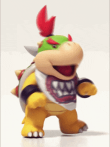 bowser jr. from super mario is dancing on a white background
