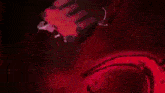 a close up of a person 's arm with a lot of red flames coming out of it .