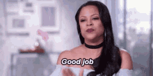 a woman is giving a thumbs up and saying good job .