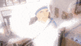 a woman in a nun costume is standing in a room with her arms outstretched in front of a window .