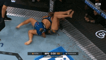two women are wrestling in a ufc match