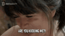 a woman says are you kidding me while laughing