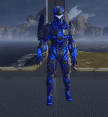a blue and black robot is standing with his arms outstretched in a video game