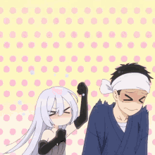 a man and a woman are standing next to each other and the man has a headband on his head