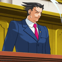 a man in a suit and tie is standing in front of a podium
