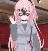 a girl with pink hair and a mask on her face is wearing a jacket .