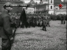a black and white photo of soldiers marching in a parade with the date march 19 1915