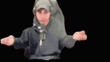 a blurry picture of a man wearing headphones and a hood