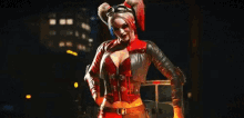 a woman in a harley quinn costume is standing in a dark room holding a gun .
