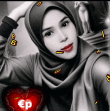 a black and white photo of a woman wearing a hijab and a heart with the word ep on it