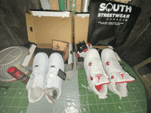 a south streetwear garage bag sits next to a pair of shoes