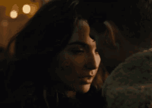 a man and woman are looking into each other 's eyes