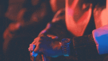 a person wearing a watch with a rolex face