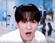 a close up of a person 's face with the name markhaeyo on the bottom right