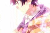 a close up of a person 's face with a purple scarf around his neck