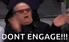 a man wearing sunglasses is making a funny face and saying `` dont engage '' .