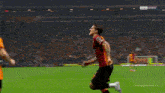 a soccer player wearing a number 7 jersey runs towards another player