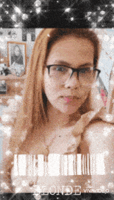 a woman wearing glasses and a necklace has the word blonde on the bottom right