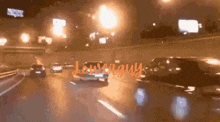 a car is driving down a highway at night and the word lower guy is on the bottom