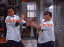 carlos and derek are standing next to each other in a room