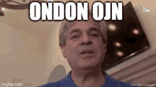 a man in a blue shirt says " ondon ojin "