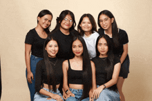 a group of young women are posing for a photo