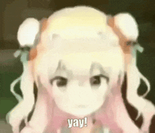 a blurred image of a girl with blonde hair and pigtails saying yay .