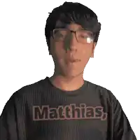 a man with glasses and a shirt that says matthias