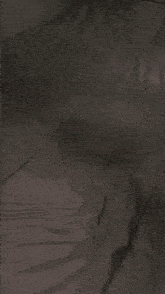 a blurred image of a person laying on a bed