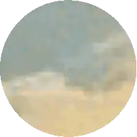a blurred image of a beach with a circle in the middle