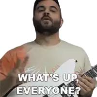 a man with a beard is playing a guitar and saying what 's up everyone ?