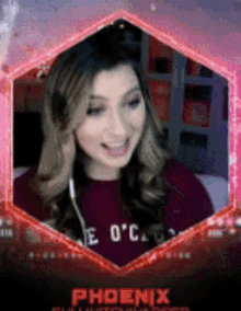 a woman wearing a red shirt that says phoenix is smiling