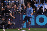 a soccer player wearing a blue shirt that says mobill on it