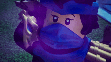 a close up of a lego character with a blue scarf around her neck