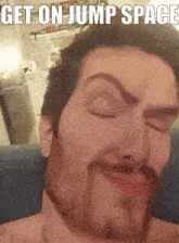 a man with a beard and nose ring is making a face with the words get on jump space below him