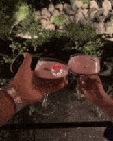 two people toasting with glasses of wine with a sticker that says " i love "
