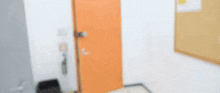 a woman is standing in a hallway holding a sign in her hand .