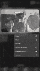 a black and white photo of a boy and a girl with the options to copy share favorite show in all photos make key photo and remove